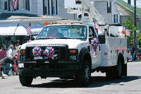 Versalift Truck and Employees in Parade